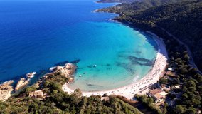 Best beaches of Corsica island. Aerial drone video of perfect round bay and beach Canella with turquoise sea and white sand. Tropical beach landscape scenery