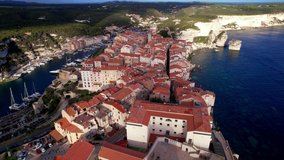 Bonifacio town on the rocks, Corsica island. aerial drone video view. popular tourist destination, France 