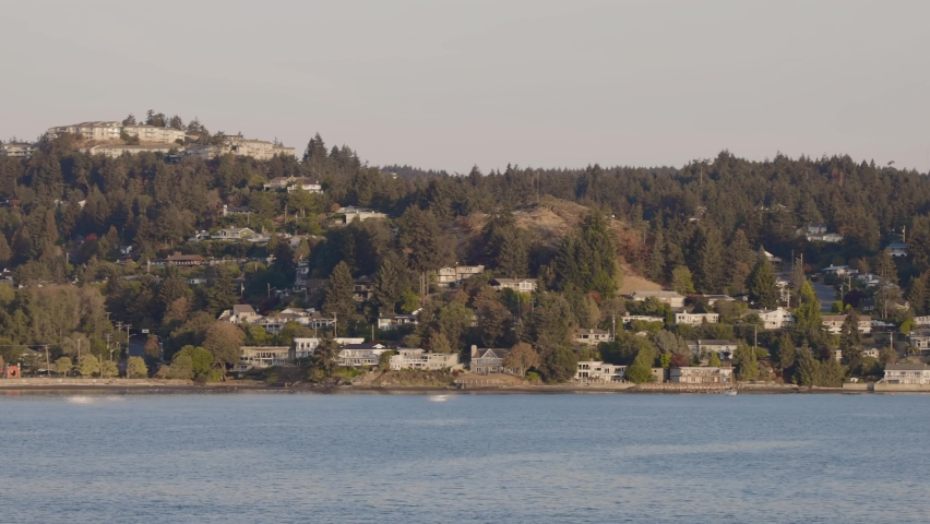 City by the water surrounded by Homes, mountains and trees. Fall Season. Nanaimo, Vancouver Island, British Columbia, Canada. City Background. Slow Motion Cinematic