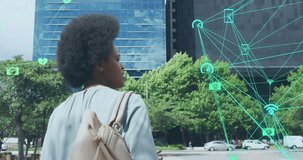 Animation of icons and business data over african american woman using smartphone. Global social media, business, connections and data processing concept digitally generated video.
