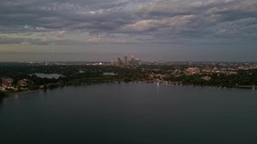 4K Reverse Aerial View Of Minneapolis Skyline From Lake Calhoun At Blue Hour