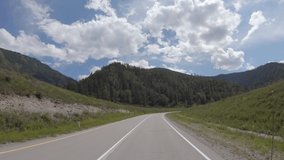 Video of driving in a car In summer season along the mountain road in Altai. Siberia, Russia