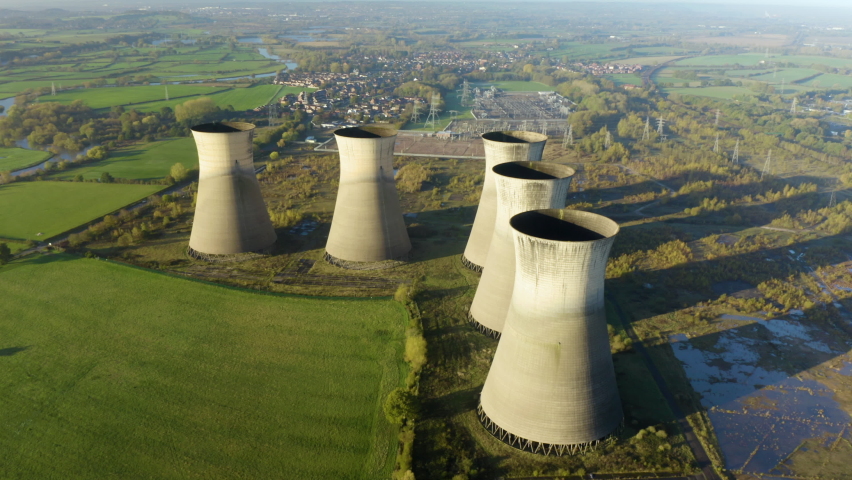 Nuclear power plant, aerial view. Drone flies over the cooling tower. Coal power plant. Aerial view to nuclear power plant. Apocalyptic landscape with an abandoned coal power plant.  Royalty-Free Stock Footage #1096953115