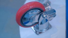 Samples of new powerful rollers for industrial trolley at the exhibition of industrial equipment. Shot in motion. Closeup - Powered by Shutterstock - Get 15% off with code: PIKWIZARD15