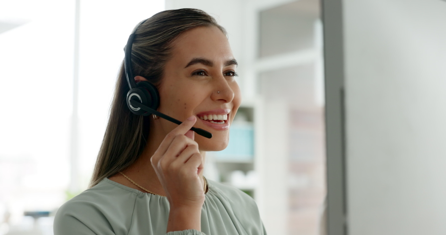 Customer service, call center and sales consultant talking while reading on computer for contact us information for help and support. Telemarketing or CRM agent at her desk for ecommerce assistance Royalty-Free Stock Footage #1096955841
