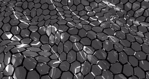 Looped abstract grid of waves of metallic or ceramic black hexagons with reflections. Abstract background. Screensaver, video in high quality 4k