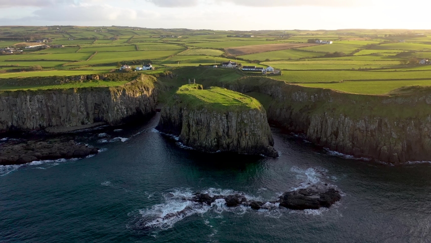 Aerial view of Dunseverick in County Antrim, in Northern Ireland. Royalty-Free Stock Footage #1096958753