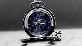 Time lapse of a pocket watch. with moving gears