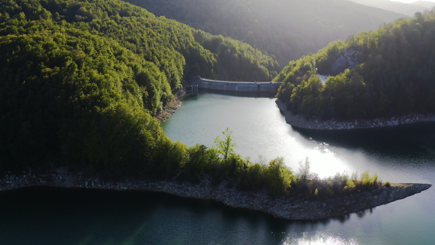 Aerial view of the dam of Irabia, inside the forest of Irati, Spaina, the second extension of beech trees in Europe. Royalty-Free Stock Footage #1096970075