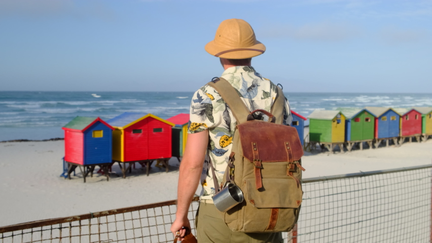 The colorful facades of medieval houses in the market square on a sunny day. Colorful homes in the historic Bo-Kaap neighborhood in Cape Town. colored dressing rooms on the ocean beach.