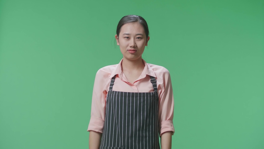 Angry Asian Female Housekeeper With An Apron Pointing And Shouting To Camera While Standing In The Green Screen Studio
 | Shutterstock HD Video #1096979209