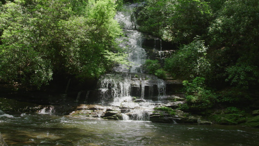 Slow Motion tilting up on beautiful waterfall in Great Smoky Mountains National Park in summer