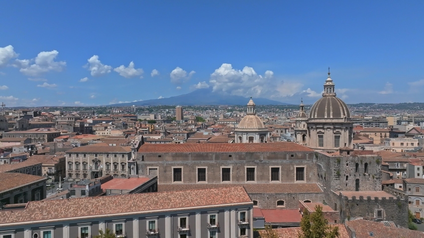 Aerial view on via Etnea in Catania. Dome of Catania and the main street with the background of volcano Etna, Sicily, Italy. Catania the UNESCO World Heritage. Royalty-Free Stock Footage #1096988053