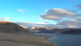 Aerial video of Pangong Lake  and mountains with clear blue sky, it's a highest saline water lake in Himalayas range, landmarks and popular for tourist attractions in Leh, Ladakh, India, Asia