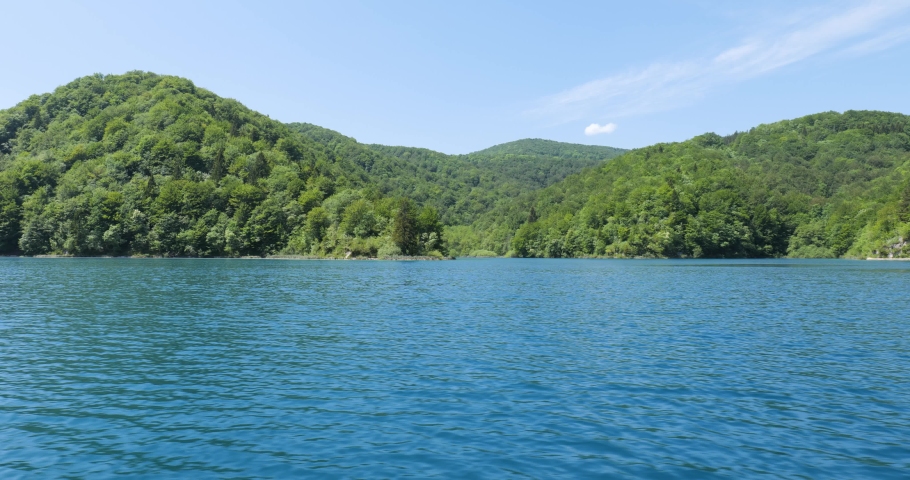 Plitvice Lakes National Park in Croatia. Unesco protected area. Natural beauty and wonder. Tourist destination. Holidays. Water and waterfalls. Vibrant colors. Sunny and beautiful day. 
