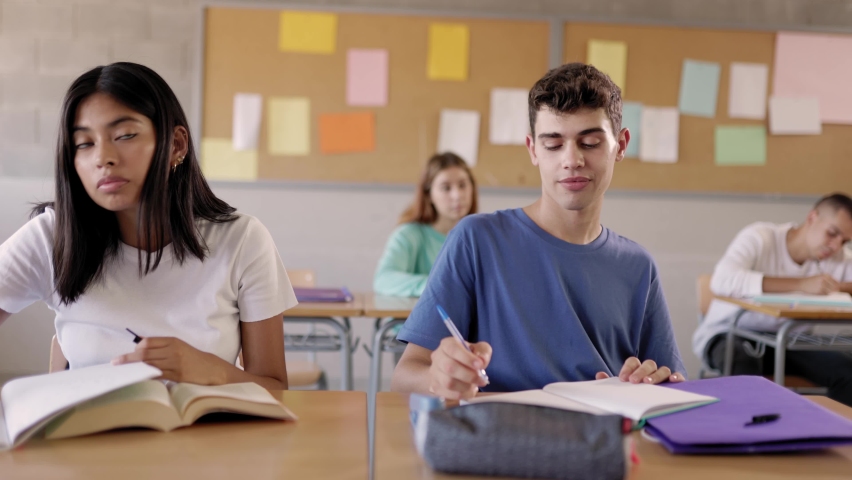 Multiracial group of student people listening teacher in classroom at high school - Education concept