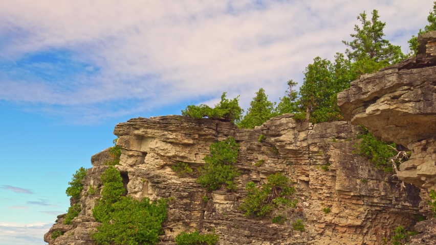 View of Indian Head Cove landscape near Grotto and Overhanging rock tourist attractions in Tobermory, Ontario, Canada. Caves of Bruce Peninsula National Park on lake Huron. Royalty-Free Stock Footage #1097011417