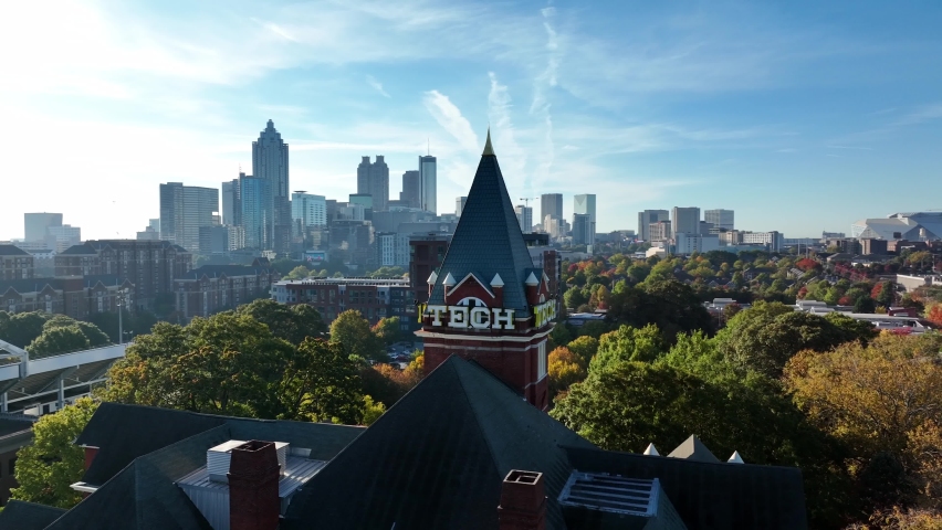 Atlanta , GA , United States - 10 24 2022: Georgia Tech sign with Bank of America building and Atlanta downtown skyline. Aerial orbit.