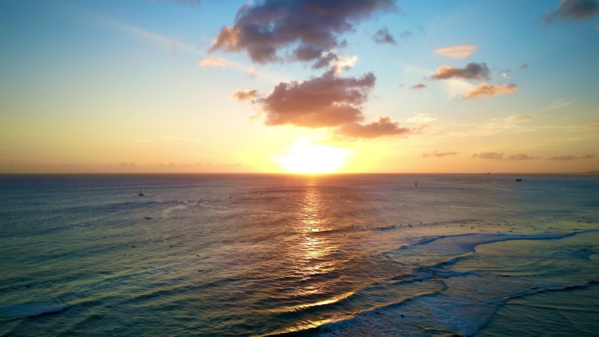 Aerial view of the sunset over the ocean horizon in Waikiki Hawai
