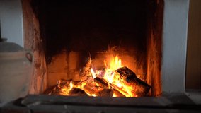 Cozy Relaxing Fireplace. TV Screen Saver. A Looping Clip of a Fireplace with Medium Size Flames Christmas Holidays Concept. Video for Meditation