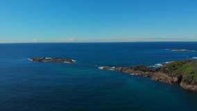 Drone video flying over Barry Park lookout toward Fingal Head on a bright spring day