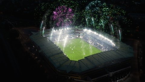 Aerial Establishing Shot of a Whole Stadium with Soccer Championship Match. Teams Play, Crowds of Fans Cheer. Football Tournament, Cup Broadcast. Sport Channel Television Playback, Screen Content Stockvideó