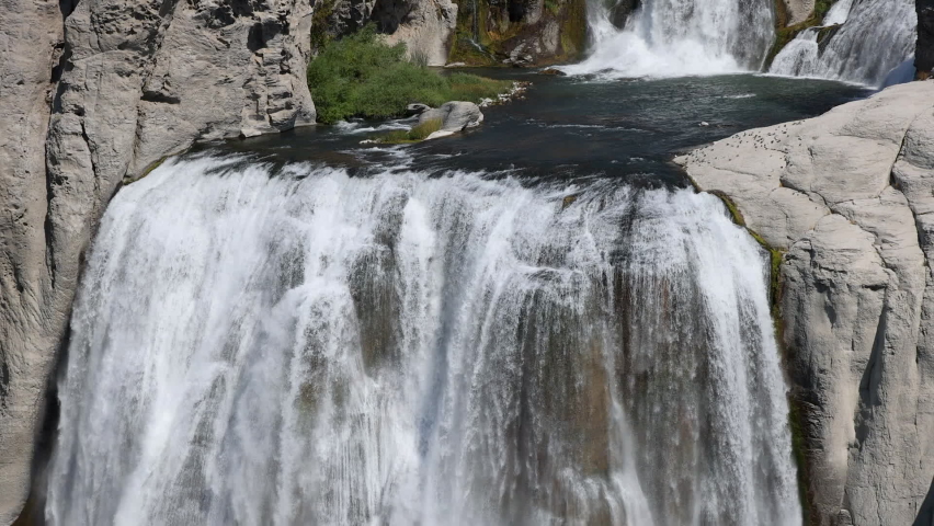 Twin Falls Idaho Snake River Waterfalls brink. Shoshone Falls. Irrigation and hydroelectric power stations is economic impact. Recreation, farming and electrical supply. Deep canyon.