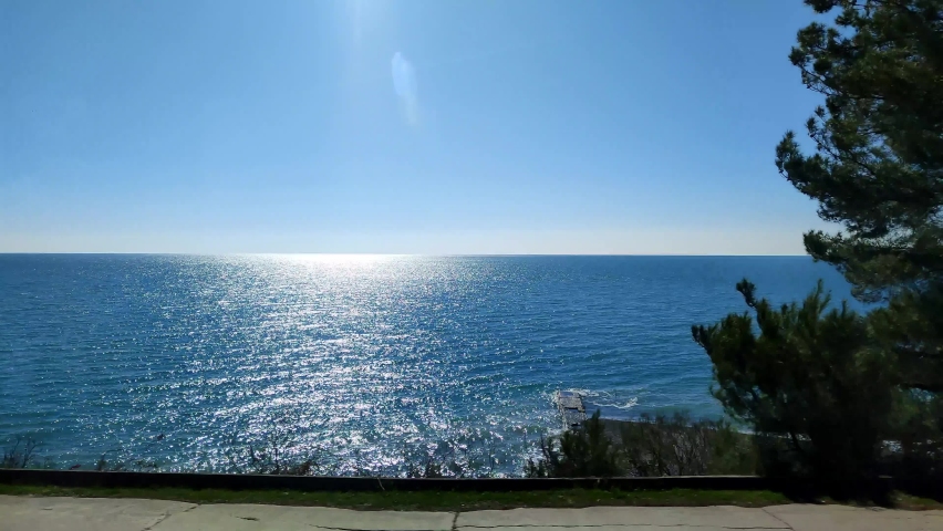Train ride along the sea shore, view from the window at empty coast at summer. Traveling, journey and summertime concept. Vacation trip or way back home, end of vacation