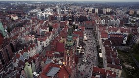 Drone video. Flying drone over evening city. Top down. Urban landscape. Church in Krakow, Poland, Europe.