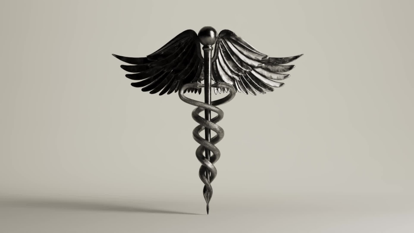 A silver caduceus symbol with wings and snakes rotating seamlessly on an isolated studio background 