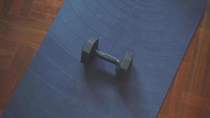Lifting dumbbell from the floor and doing a bicep curls Royalty-Free Stock Footage #1097059001
