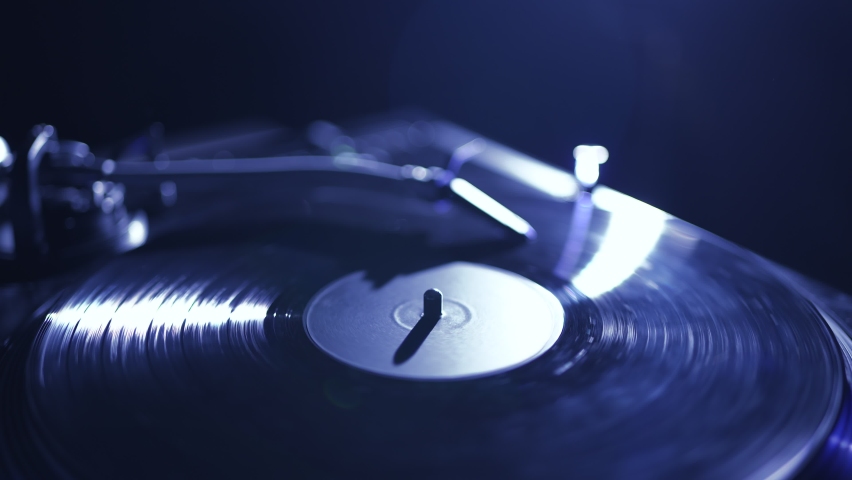 Djs turntable plays vinyl record with techno music on night club party Royalty-Free Stock Footage #1097059547