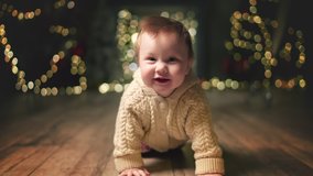 baby happily crawls on camera on Eve. Family Spending Winter Evening at Home. Young Mother with Little Kid Son play. Slow Motion. Christmas, New Year, Winter Holiday Celebration. 4K 10 bit colors - Powered by Shutterstock - Get 15% off with code: PIKWIZARD15
