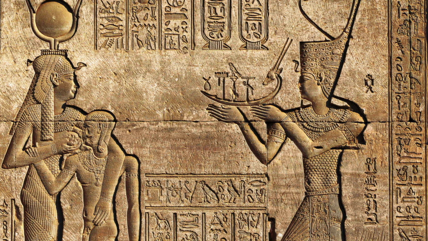 Hieroglyphic carvings on the exterior walls of an ancient egyptian temple,panorama