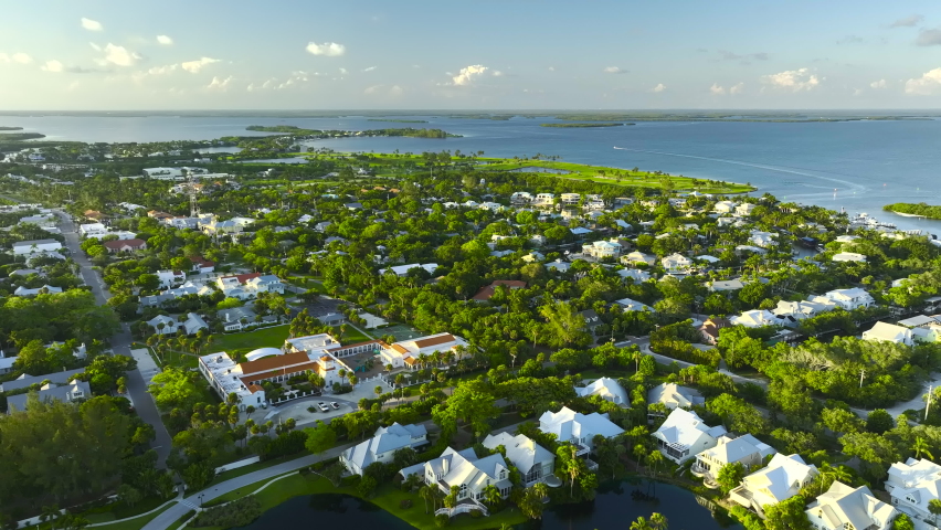 View from above of large residential houses in island small town Boca Grande on Gasparilla Island in southwest Florida. American dream homes as example of real estate development in US suburbs Royalty-Free Stock Footage #1097067795