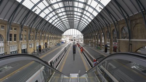 LONDON - JUNE 17, 2015: People inside King's Cross railway station, a major London railway terminus which opened in 1852 on the northern edge of central London.