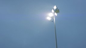 HANDHELD View of stadium flood lights are turning on, heavy rain, bad weather - Powered by Shutterstock - Get 15% off with code: PIKWIZARD15