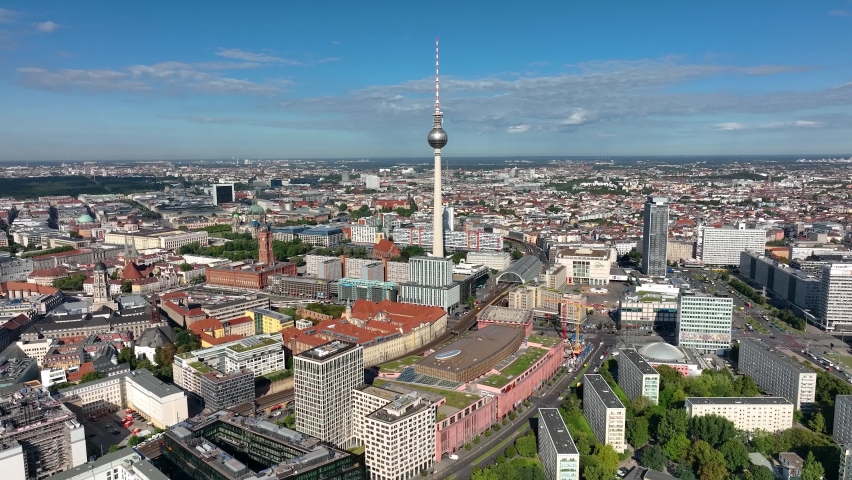 City of Berlin, Germany from above.Aerial view of cityscape showing architectural landmarks Fernsehturm TV Tower and Berlin Cathedral by day. Drone Flight over Alexanderplatz TV Tower, Sunflairs circa Royalty-Free Stock Footage #1097069771