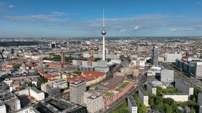 City of Berlin, Germany from above.Aerial view of cityscape showing architectural landmarks Fernsehturm TV Tower and Berlin Cathedral by day. Drone Flight over Alexanderplatz TV Tower, Sunflairs circa