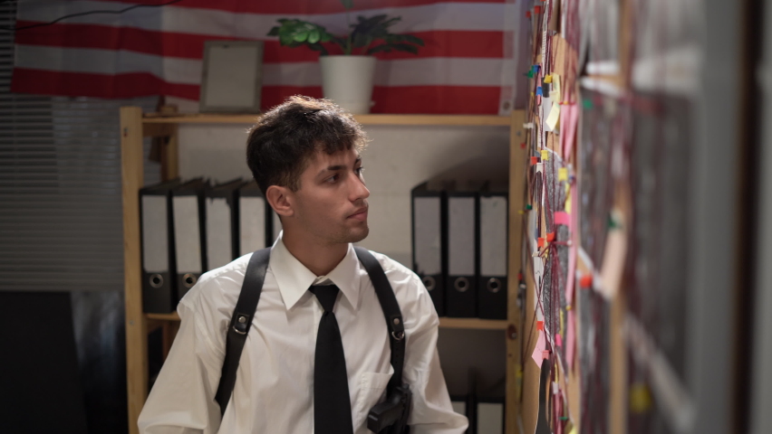 Man detective searching terrorist act connections working in office, figuring out danger place