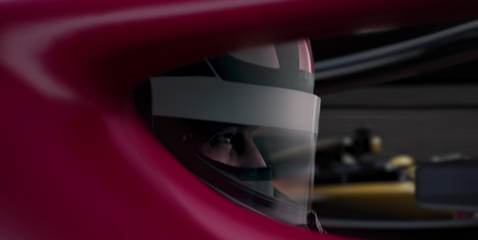 ECU Portrait of sports car driver in protective helmet racing on a speedway. Fast speed, motorsport