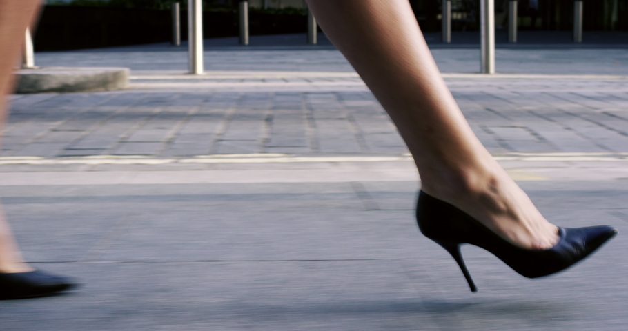 Woman, city and walking in street with stilettos to business, work or job in finance company. Closeup, feet and formal shoes for businesswoman with speed, fast and walk in sidewalk to office in metro Royalty-Free Stock Footage #1097079645