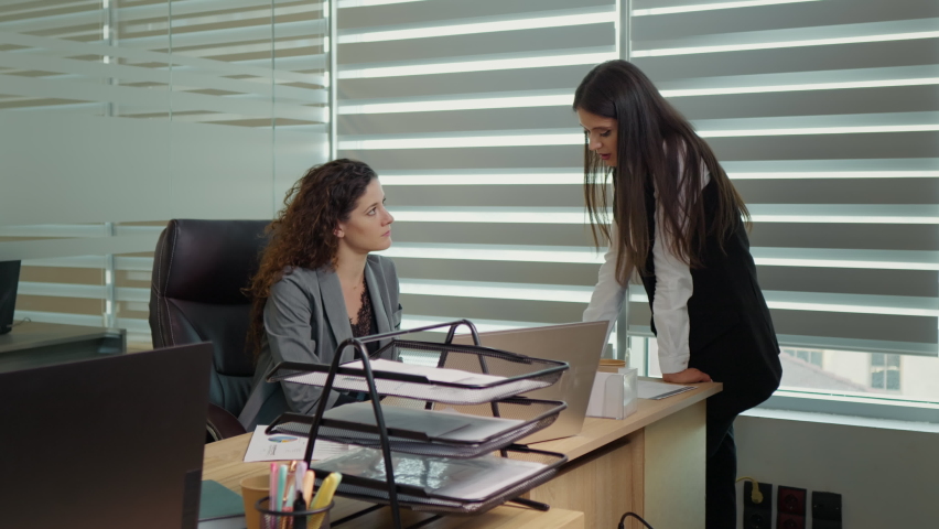 Two collegues discussing personal problems one making a tap on others sholder to support her. Office workers talking about breakup. Friend sharing bad news about family members. | Shutterstock HD Video #1097088635