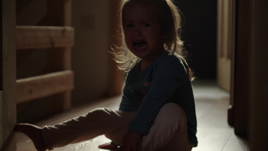 domestic violence. little girl crying and sobing in the morning at home. punished in the corner crying tears. domestic kid abuse fear concept. autistic child is punished and beaten afraid of fear Royalty-Free Stock Footage #1097091089