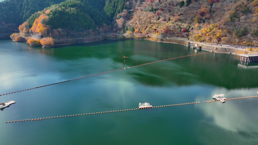water dam and reservoir lake in the mountains, aerial view of hydropower electric power plant for renewable energy, industrial engineering, water resources. High quality 4k footage Royalty-Free Stock Footage #1097092855