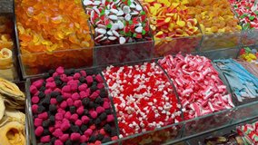 Colorful gummies and jellybeans in grand bazaar in Istanbul. Variety of sweet candies at store window display in Turkey - Powered by Shutterstock - Get 15% off with code: PIKWIZARD15