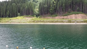 Sights of the modern popular ski resort of Bukovel. Lake of Youth in Bukovel in summer. It is the largest ski resort in Eastern Europe situated in West of Ukraine. 