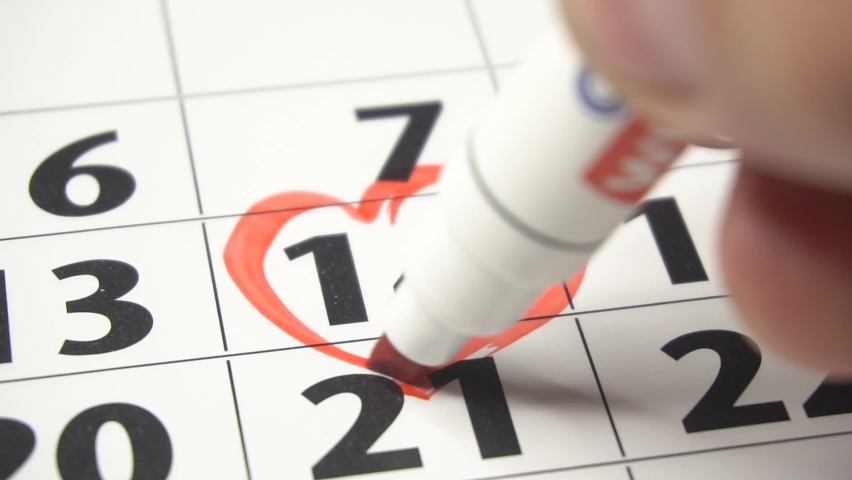 Writing RED HEART on 14th February on calendar with a red marker. The concept of Valentine's day Royalty-Free Stock Footage #1097103053