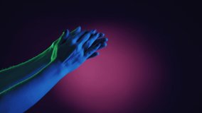 Bravo applause. Body gesture. Well done expression. Unrecognizable woman clapping hands on neon light dark purple green background copy space.