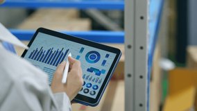Worker checking inventory on a tablet warehouse management system. - Powered by Shutterstock - Get 15% off with code: PIKWIZARD15